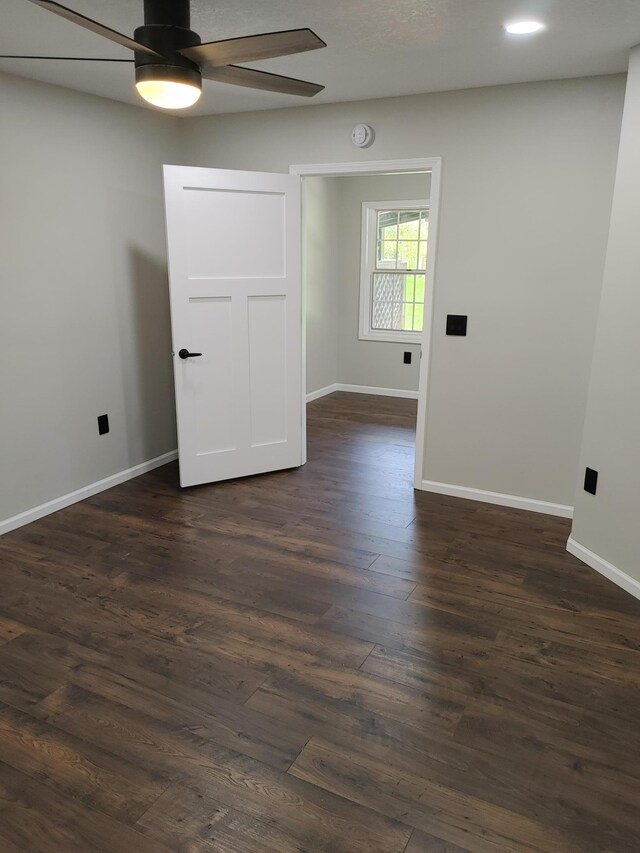 3245 Laketown Rd, Sturgeon Lake, MN 55783 - spare room with a ceiling fan, dark wood finished floors, and baseboards