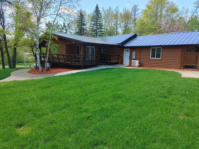 3245 Laketown Rd, Sturgeon Lake, MN 55783 - back of property featuring faux log siding, a yard, and metal roof