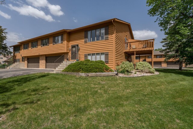 45 Restless Ct Unit 101, North Mankato, MN 56003 - view of front of home featuring a garage, a front yard, and driveway