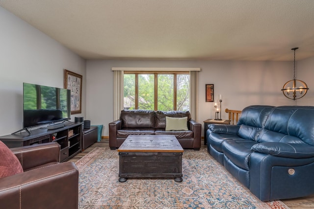 45 Restless Ct Unit 101, North Mankato, MN 56003 - living room featuring a chandelier, wood finished floors, and a textured ceiling