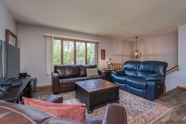 45 Restless Ct Unit 101, North Mankato, MN 56003 - living area featuring wood finished floors, a textured ceiling, and a chandelier