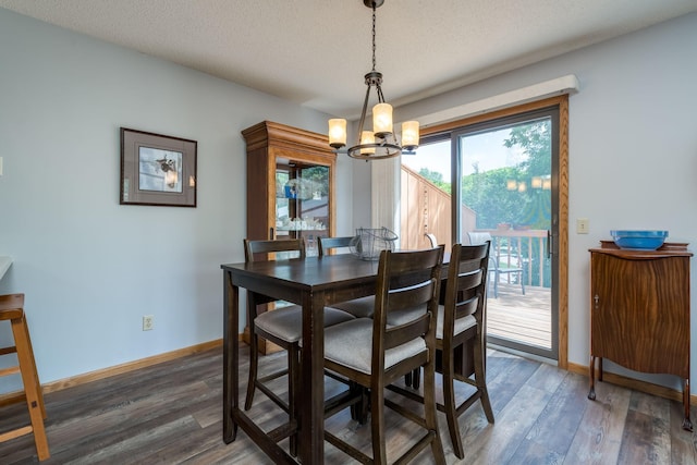 45 Restless Ct Unit 101, North Mankato, MN 56003 - dining space featuring a chandelier, wood finished floors, baseboards, and a textured ceiling