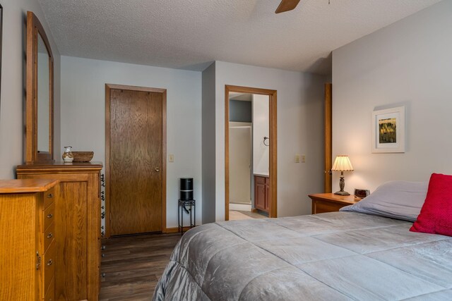 45 Restless Ct Unit 101, North Mankato, MN 56003 - bedroom featuring wood finished floors, a textured ceiling, ensuite bath, and ceiling fan