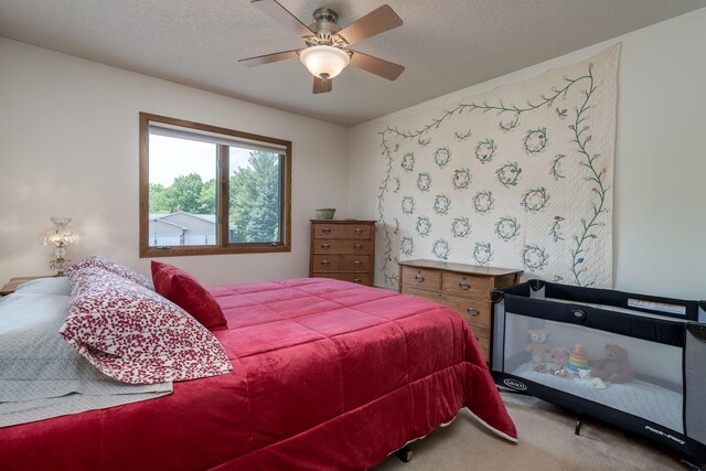 45 Restless Ct Unit 101, North Mankato, MN 56003 - carpeted bedroom featuring ceiling fan and a textured ceiling