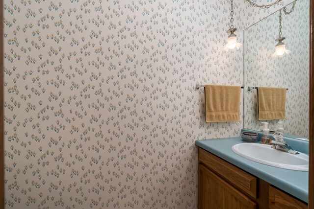 45 Restless Ct Unit 101, North Mankato, MN 56003 - bathroom featuring wallpapered walls and vanity