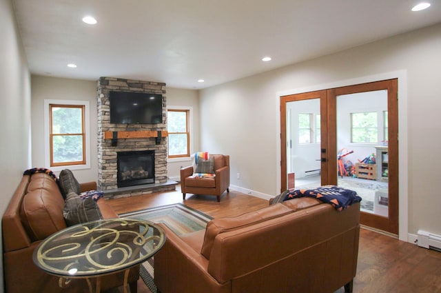10551 Shore Dr, Merrifield, MN 56465 - living room featuring healthy amount of natural light, dark wood-style floors, french doors, a stone fireplace, and recessed lighting