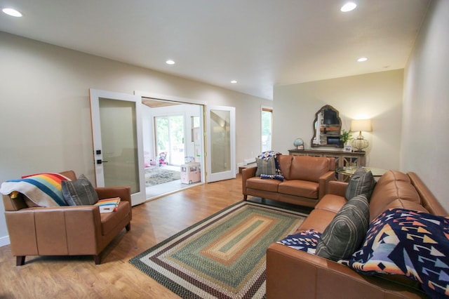10551 Shore Dr, Merrifield, MN 56465 - living room featuring recessed lighting, french doors, and wood finished floors