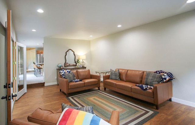 10551 Shore Dr, Merrifield, MN 56465 - living room with wood finished floors, recessed lighting, and french doors