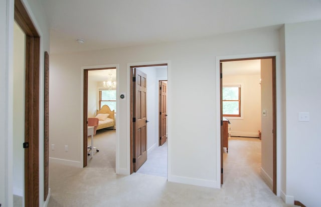 10551 Shore Dr, Merrifield, MN 56465 - corridor with a chandelier and light colored carpet