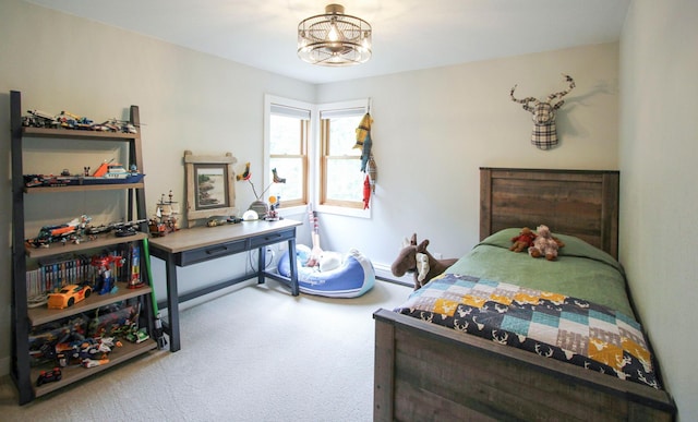10551 Shore Dr, Merrifield, MN 56465 - carpeted bedroom featuring a baseboard radiator and a chandelier