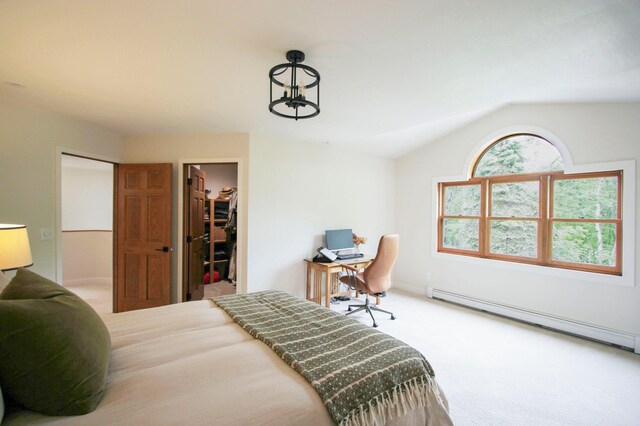 10551 Shore Dr, Merrifield, MN 56465 - carpeted bedroom with baseboard heating, vaulted ceiling, a walk in closet, and a closet