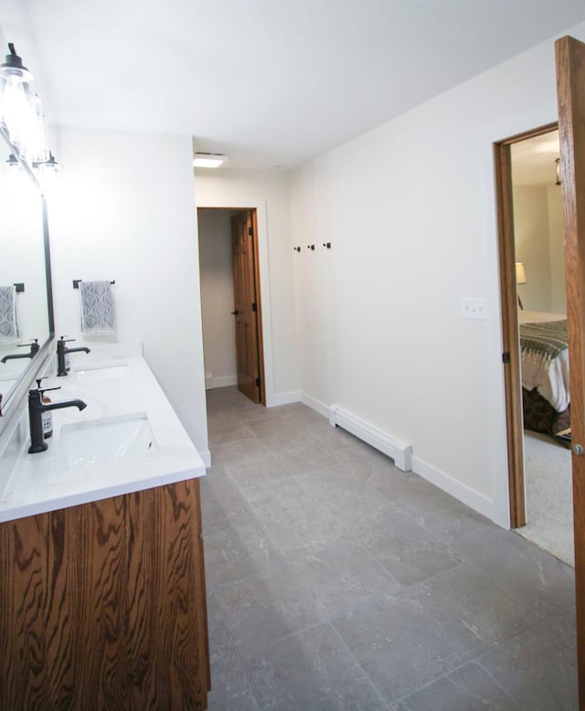 10551 Shore Dr, Merrifield, MN 56465 - bathroom with a baseboard radiator and double vanity