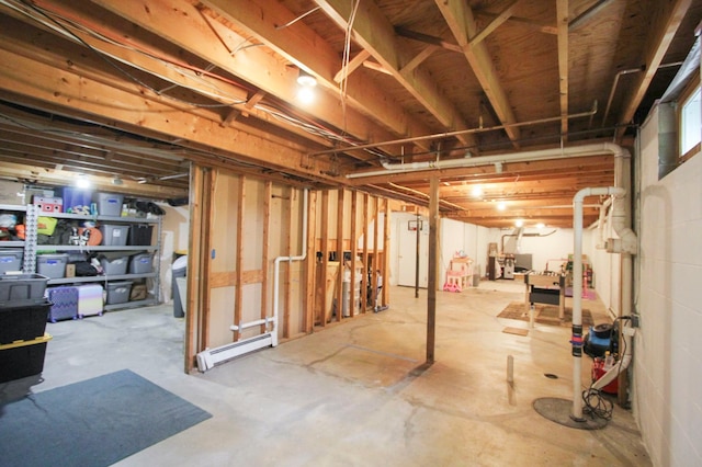 10551 Shore Dr, Merrifield, MN 56465 - unfinished below grade area featuring a baseboard heating unit