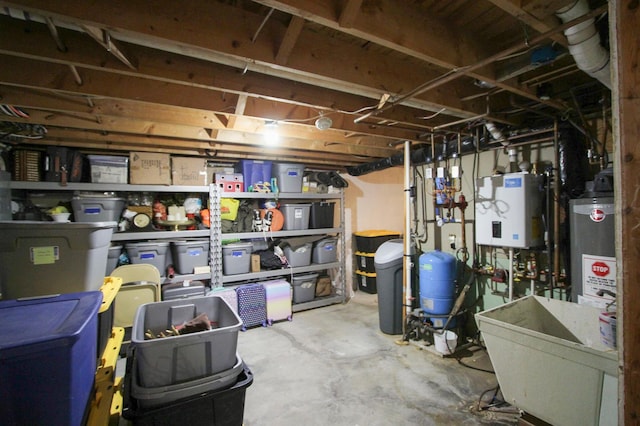 10551 Shore Dr, Merrifield, MN 56465 - unfinished basement featuring water heater, gas water heater, and a water pressure tank