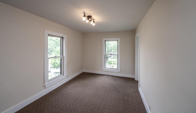 711 2nd St W, Northfield, MN 55057 - spare room featuring baseboards and carpet floors
