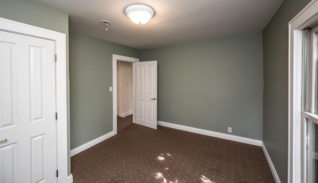 711 2nd St W, Northfield, MN 55057 - unfurnished bedroom with carpet and baseboards