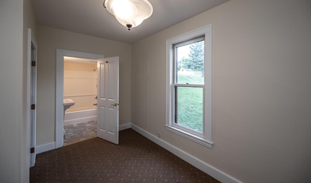 711 2nd St W, Northfield, MN 55057 - spare room featuring baseboards and carpet flooring