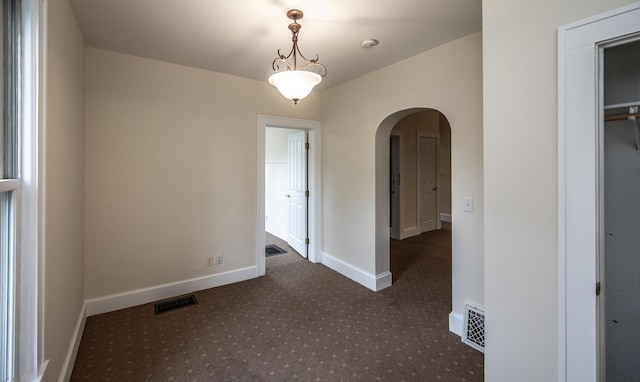 711 2nd St W, Northfield, MN 55057 - carpeted spare room with arched walkways and baseboards