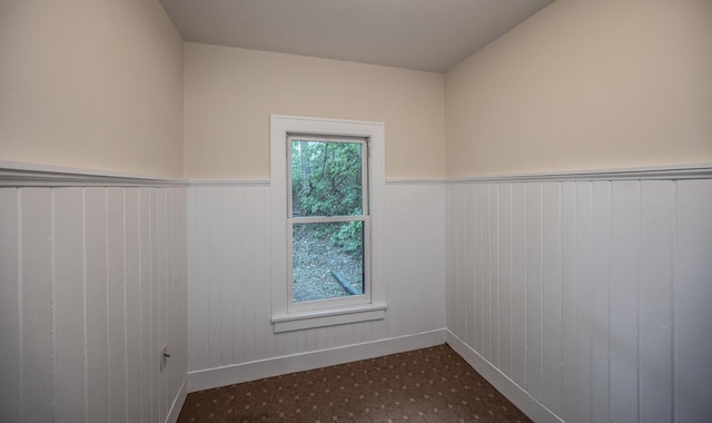 711 2nd St W, Northfield, MN 55057 - unfurnished room with a wainscoted wall and baseboards