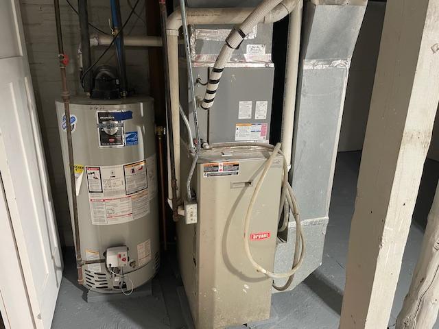 utilities featuring water heater and heating unit