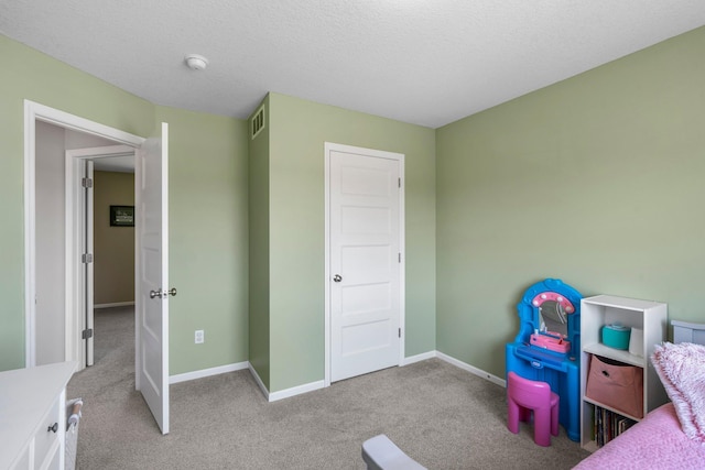 bedroom with carpet flooring and baseboards