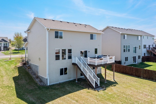 rear view of property with a wooden deck and stairs
