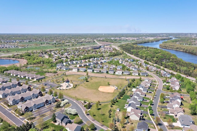 aerial overview of property's location featuring a nearby body of water and nearby suburban area