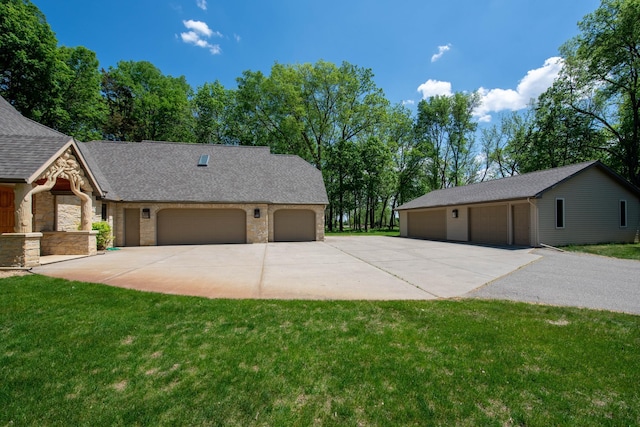 4214 Fairview Ln, Jamestown Twp, MN 56063 - view of front of property with stone siding, a front yard, and driveway