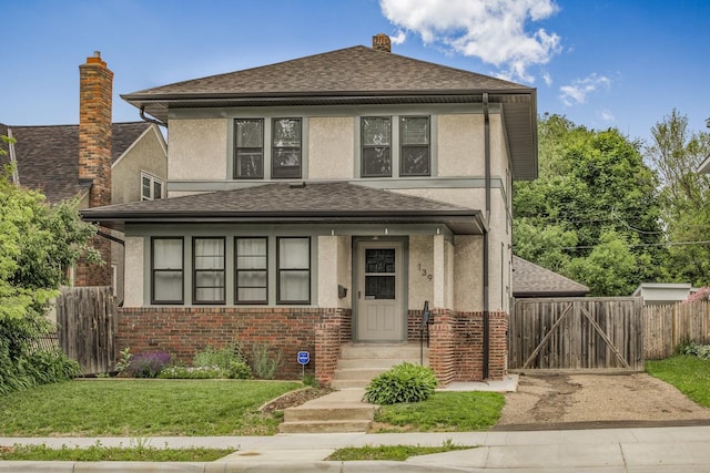 139 Annapolis St E, Saint Paul, MN 55118 - view of front of property with stucco siding, brick siding, a chimney, a gate, and a shingled roof