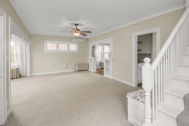 139 Annapolis St E, Saint Paul, MN 55118 - empty room featuring radiator, stairway, a wall mounted air conditioner, carpet flooring, and ceiling fan