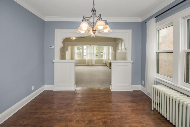 139 Annapolis St E, Saint Paul, MN 55118 - unfurnished dining area with radiator heating unit, a chandelier, crown molding, baseboards, and dark wood-style floors