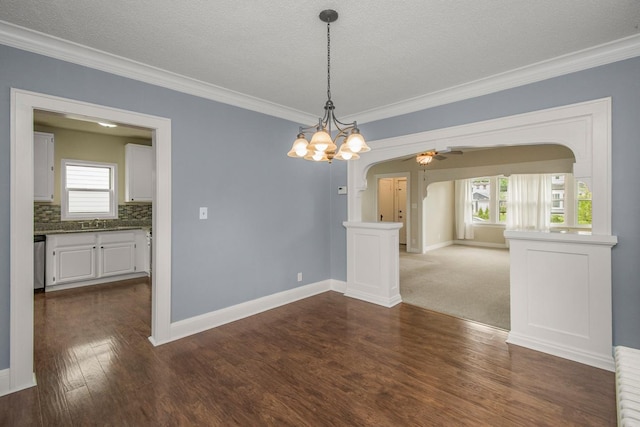 139 Annapolis St E, Saint Paul, MN 55118 - empty room with a ceiling fan, crown molding, arched walkways, dark wood-type flooring, and a sink