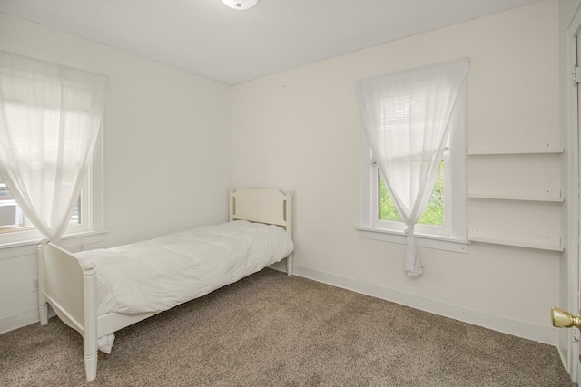 139 Annapolis St E, Saint Paul, MN 55118 - carpeted bedroom featuring multiple windows and baseboards