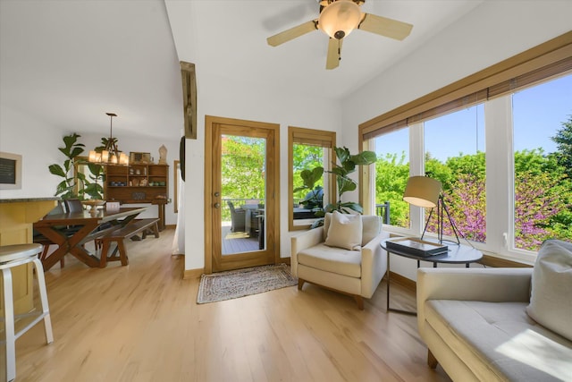 2907 Cougar Path NW, Prior Lake, MN 55372 - sitting room with light wood finished floors, a chandelier, and a ceiling fan