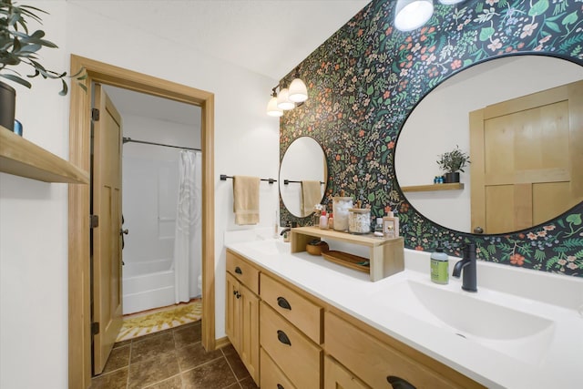 2907 Cougar Path NW, Prior Lake, MN 55372 - full bath with wallpapered walls, double vanity, and shower / bathtub combination with curtain