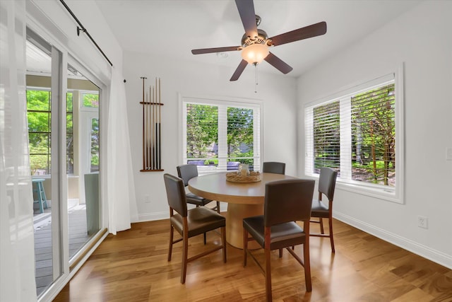 2907 Cougar Path NW, Prior Lake, MN 55372 - dining area with light wood-type flooring, baseboards, and ceiling fan