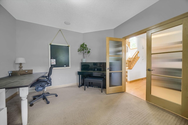 2907 Cougar Path NW, Prior Lake, MN 55372 - home office featuring baseboards, carpet, a textured ceiling, and french doors