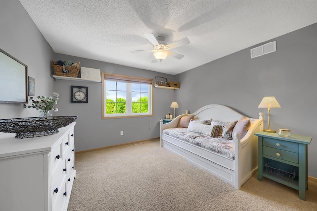 2907 Cougar Path NW, Prior Lake, MN 55372 - bedroom with light carpet, baseboards, a textured ceiling, and ceiling fan