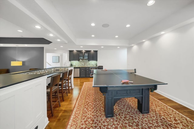 2907 Cougar Path NW, Prior Lake, MN 55372 - playroom featuring a tray ceiling, recessed lighting, light wood-style floors, and baseboards