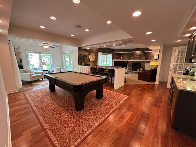 2907 Cougar Path NW, Prior Lake, MN 55372 - recreation room featuring plenty of natural light, billiards, wood finished floors, recessed lighting, and a stone fireplace
