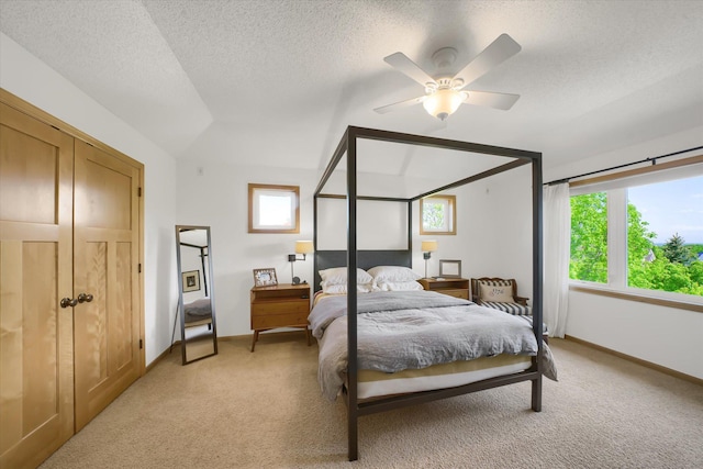 2907 Cougar Path NW, Prior Lake, MN 55372 - bedroom with light carpet, multiple windows, ceiling fan, a textured ceiling, and lofted ceiling
