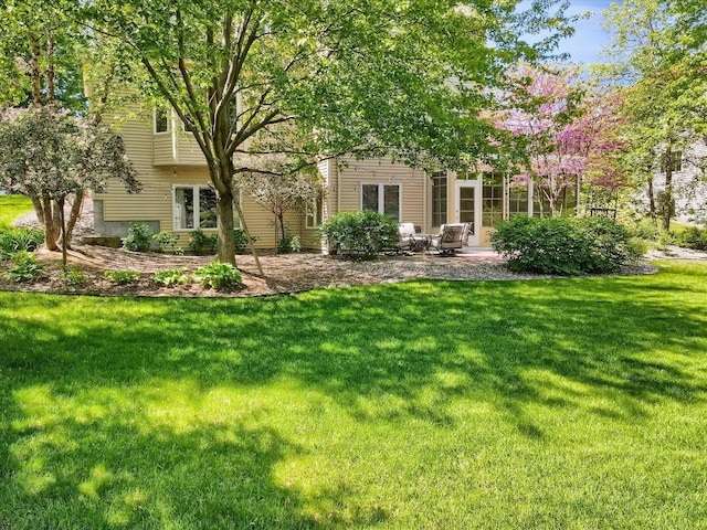 2907 Cougar Path NW, Prior Lake, MN 55372 - rear view of property featuring a lawn and a patio