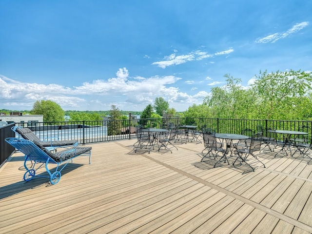 2700 44th St Unit 116, Minneapolis, MN 55410 - wooden terrace with outdoor dining area
