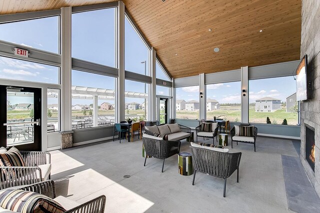 17022 Draper Way, Lakeville, MN 55044 - sunroom / solarium featuring an outdoor living space with a fireplace, high vaulted ceiling, and wooden ceiling