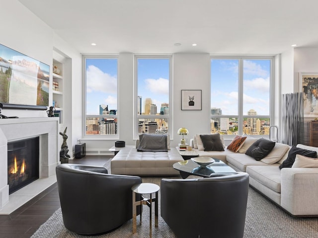 1111 River Pkwy Unit 33A, Minneapolis, MN 55415 - living room with wood finished floors, plenty of natural light, a fireplace with flush hearth, recessed lighting, and a city view