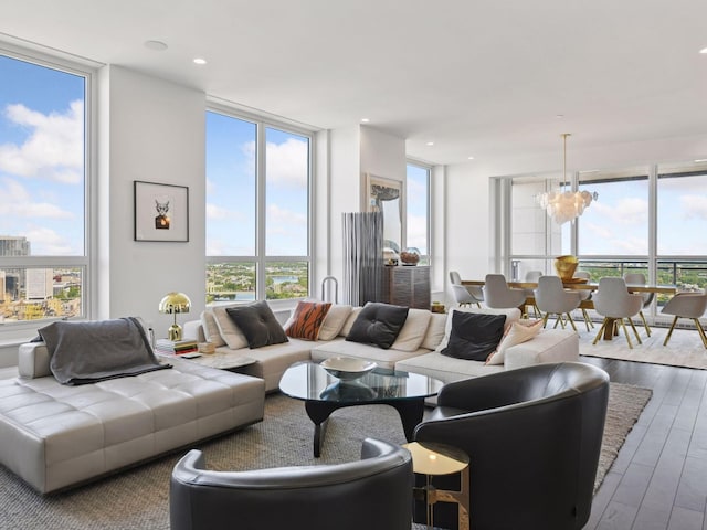 1111 River Pkwy Unit 33A, Minneapolis, MN 55415 - living area featuring floor to ceiling windows, wood-type flooring, and a chandelier