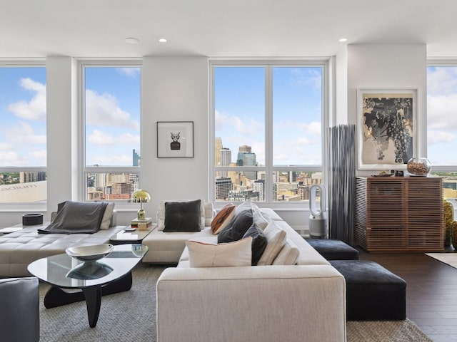 1111 River Pkwy Unit 33A, Minneapolis, MN 55415 - living room featuring wood finished floors, a city view, expansive windows, and recessed lighting