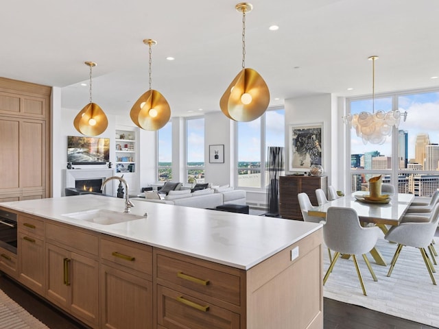 1111 River Pkwy Unit 33A, Minneapolis, MN 55415 - kitchen with a sink, dark wood-style floors, light countertops, open floor plan, and recessed lighting