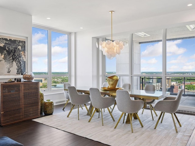 1111 River Pkwy Unit 33A, Minneapolis, MN 55415 - dining space with a chandelier, wood-type flooring, expansive windows, and recessed lighting