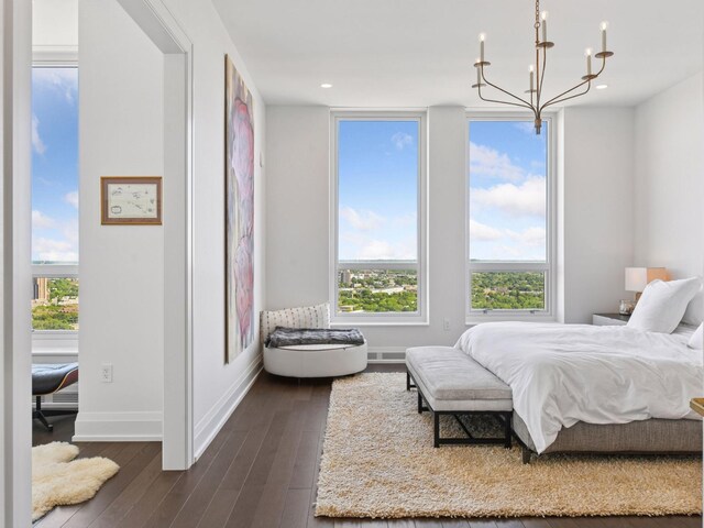1111 River Pkwy Unit 33A, Minneapolis, MN 55415 - bedroom featuring a chandelier, dark wood-type flooring, baseboards, and recessed lighting